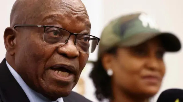 Former South African president Jacob Zuma gestures next to his daughter Duduzile Zuma, during a news conference in Johannesburg, South Africa, October 22, 2022