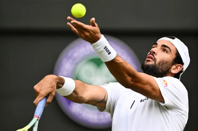 Matteo Berrettini throws the ball up to serve