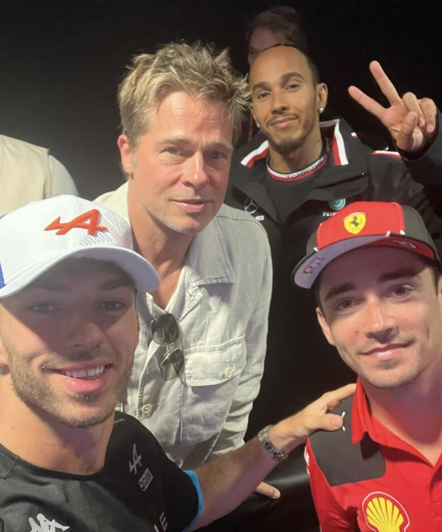 Pierre Gasly, Charles Leclerc and Pierre Gasly pose with Brad Pitt