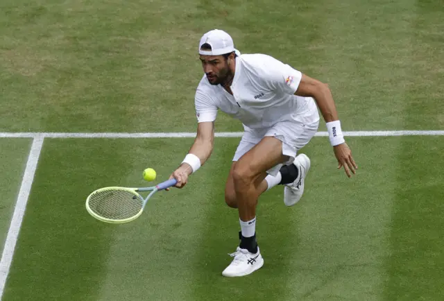 Matteo Berrettini hits a low volley shot