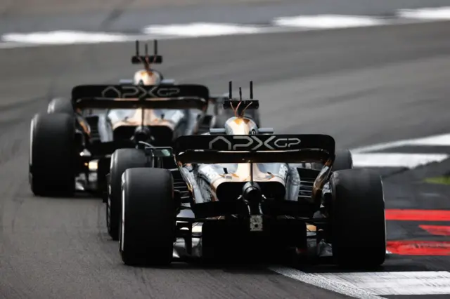 The APXGP racing cars out on track filming at Silverstone