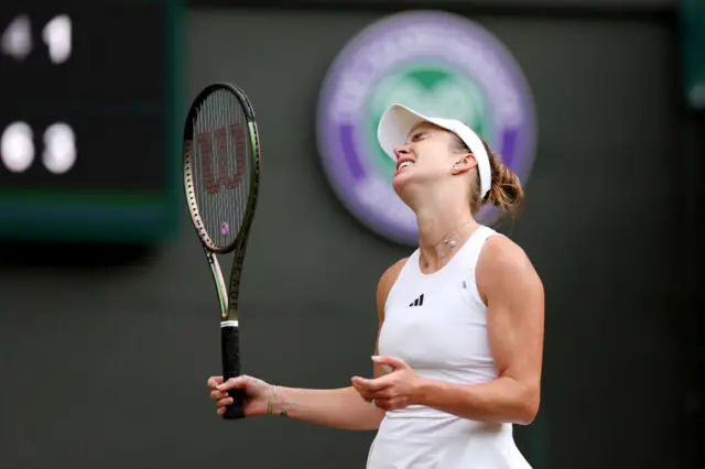 Elina Svitolina winces in despair after losing a point