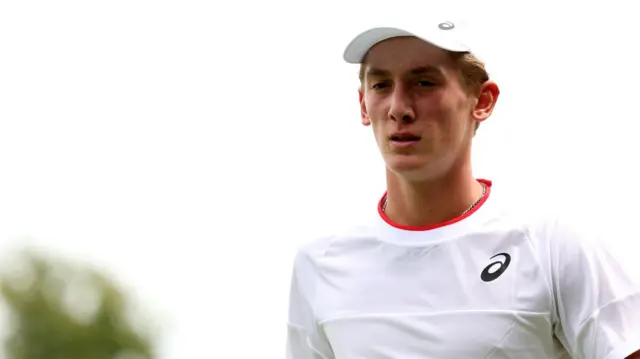 Henry Searle in action at Wimbledon