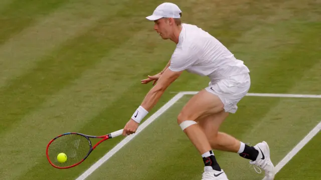 Denis Shapovalov plays a backhand