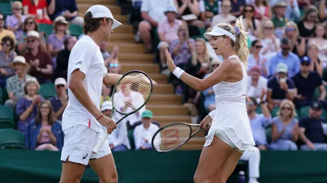 Alex de Minaur and Katie Boulter high five each other