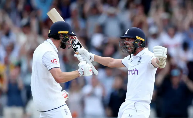 Chris Woakes and Mark Wood celebrate winning the third Test v Australia