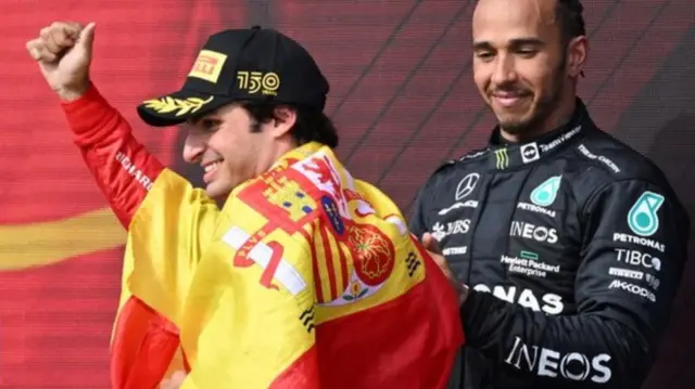 Carlos Sainz celebrates on the Silverstone podium in 2022