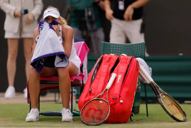 Mirra Andreeva sitting down after her victory