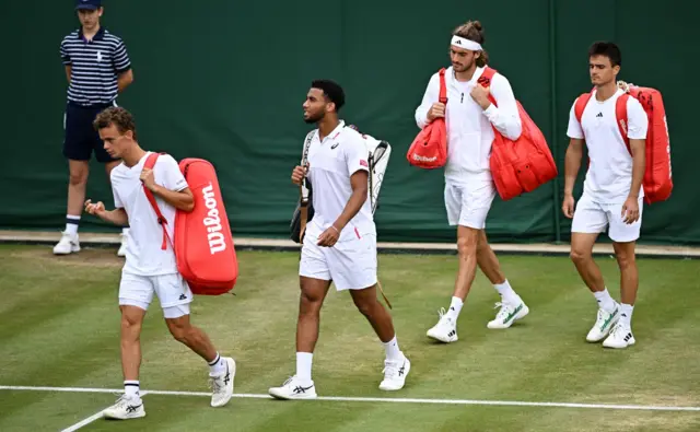 Stefanos Tsitsipas walks onto court