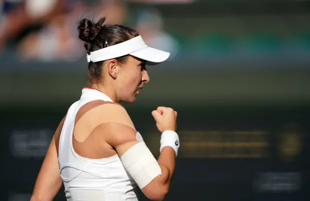 Belinda Bencic clenches her fist in celebration