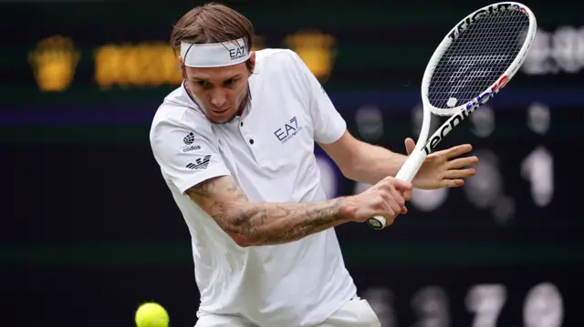 Alexander Bublik plays a backhand