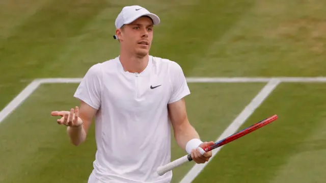 Denis Shapovalov with arms outstretched