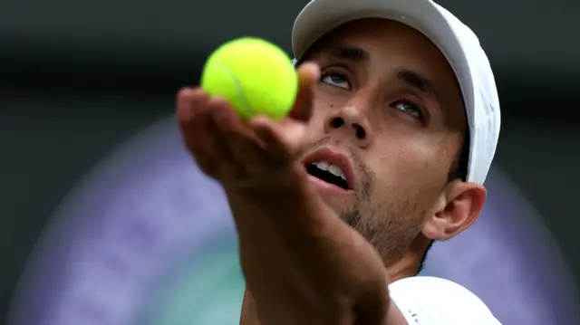 Daniel Galan serves