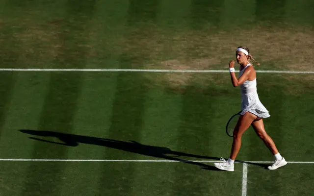 Victoria Azarenka pumps her fist in celebration