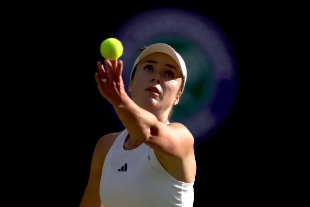 Elina Svitolina tosses the ball to serve