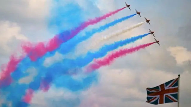 the "Red Arrows", performs a fly-past