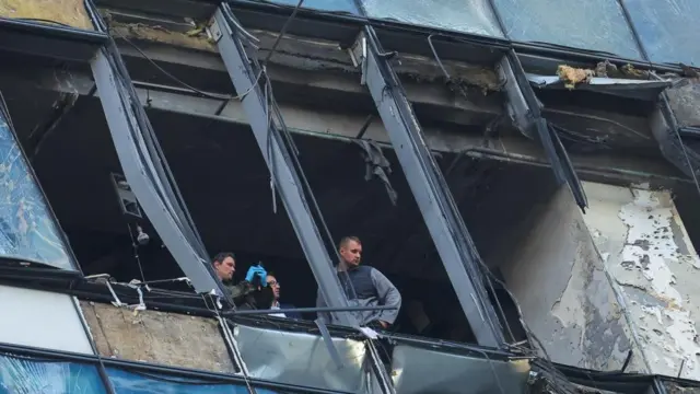 Members of security services investigate a damaged office building in the Moscow City following a reported Ukrainian drone attack in Moscow Russia, August 1, 2023.