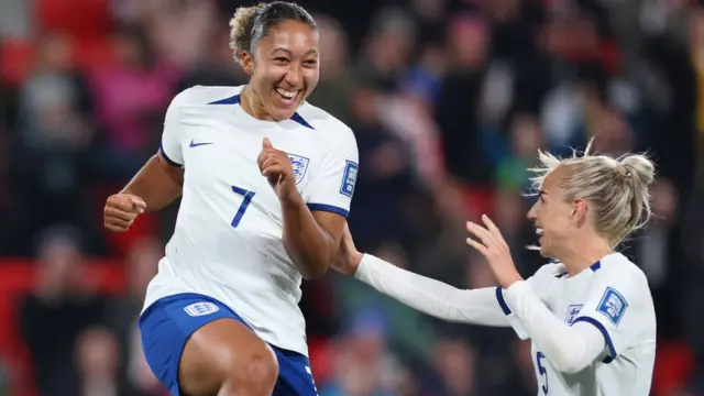 Lauren James and Alex Greenwood celebrate