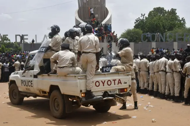 Nigerien policemen are seen as supporters rally in support of Niger's junta in Niamey on July 30, 2023.