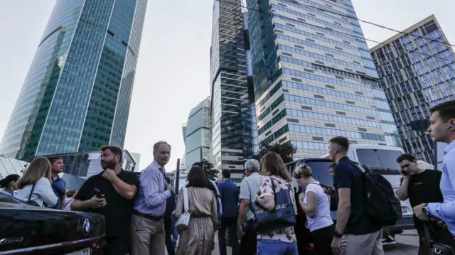 People walk through Moscow