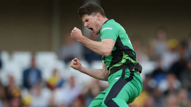 George Garton celebrates the wicket of Tom Kohler-Cadmore