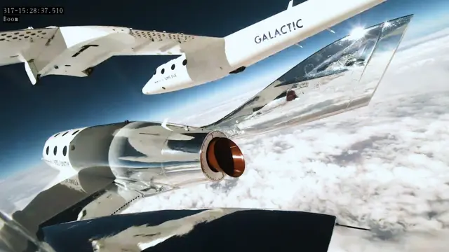 Virgin Galactic's Unity rocket plane flies above clouds