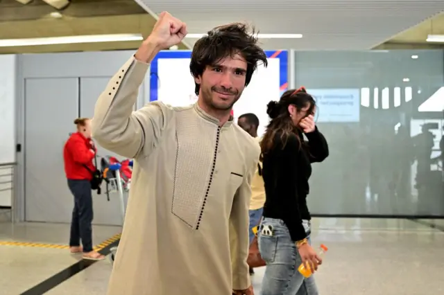 French-Spanish lawyer Juan Branco reacts upon his arrival in France on 8 August.