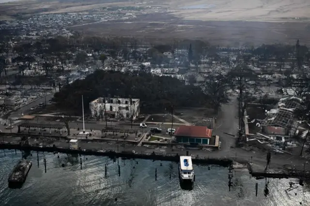 This view shows the Banyan Tree (centre, behind the white building), planted in 1873 to mark 50th anniversary of the first Protestant mission to Hawaii. It's unclear at this point how much damage the tree has suffered from the fire