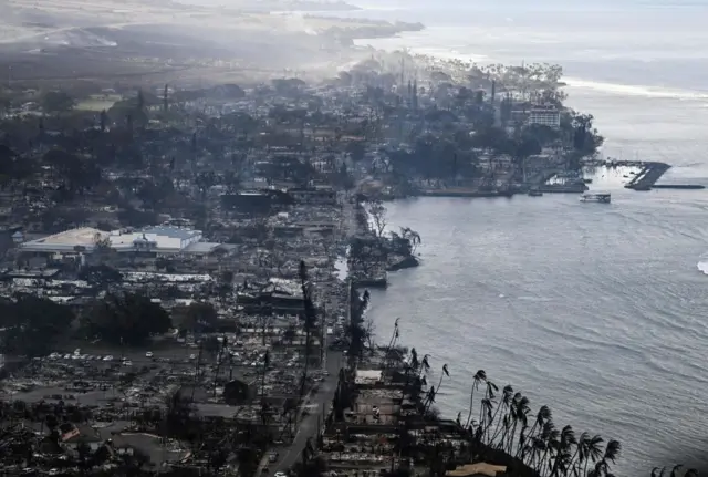 An aerial view shows the destruction around the harbor in Lahaina