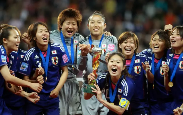 Homara Sawa of Japan lifts the trophy after the FIFA Women's World Cup Final match between Japan and USA