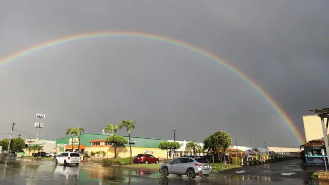 A rainbow in Maui, with grey skies in the background