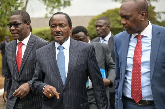 James Opiyo Wandayi leader of minority in Parliament, Stephen Kalonzo Musyoka, Wiper party leader and a principle of the Azimio la Umoja Coalition, and Jeremah Kioni, arrive at the venue for the bipartisan talks with Kenya Kwanza members at the bomas of Kenya in Nairobi on August 9, 2023.