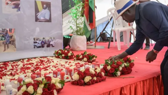 Kenyan opposition leader Raila Odinga lays flowers during the candle light vigil in memory of slain protesters from recent anti-government protests in Nairobi, on July 26, 2023.