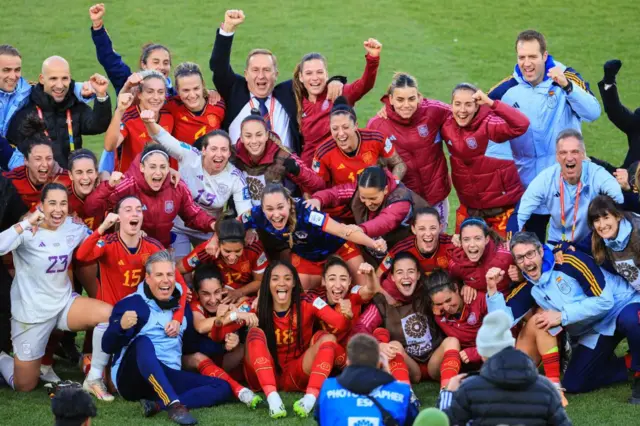 Spain players celebrate their victory over the Netherlands