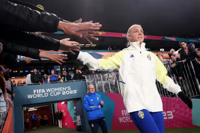 Caroline Seger of Sweden high fives with fans