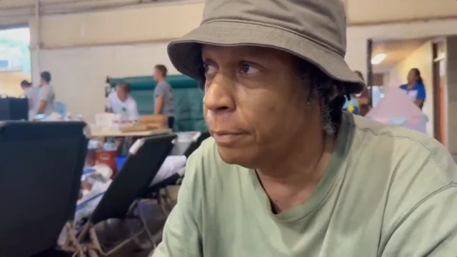 Les Munn, seated in the evacuation shelter