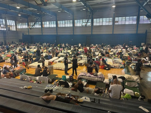 Evacuees at Maui's War Memorial Stadium