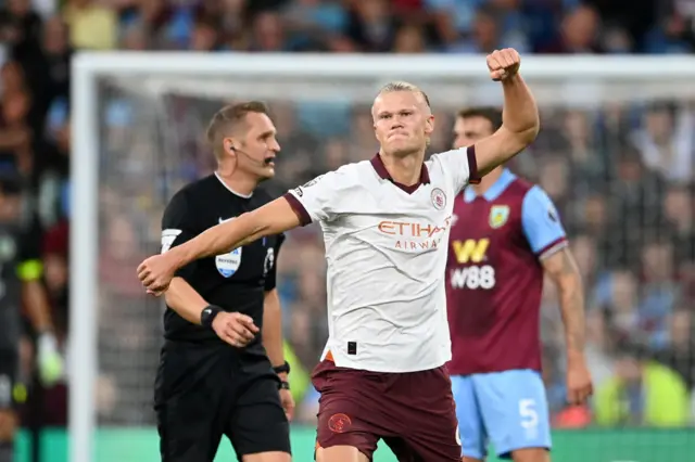 Haaland fist pumps at the away end after scoring his second.