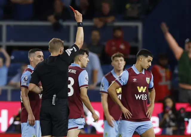 Zaroury gets shown a red card for his high tackle.