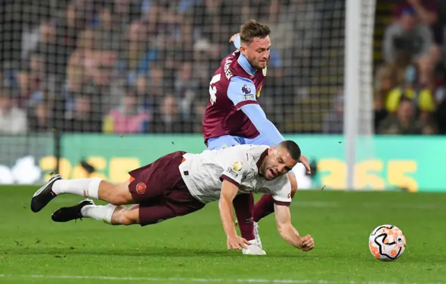 Laursen fouls Kovacic in the midfield.