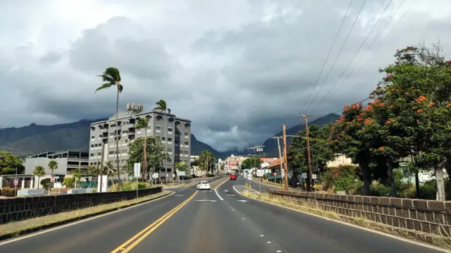 A view of a road, building and trees on Maui