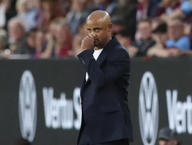 Kompany holds his face in concentration as his side trail the champions.