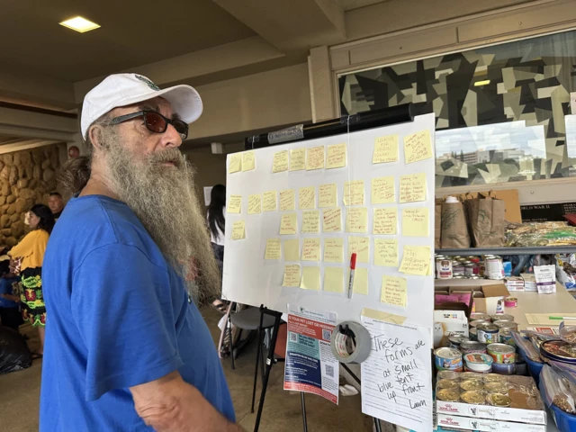 A man in Maui peruses the whiteboard