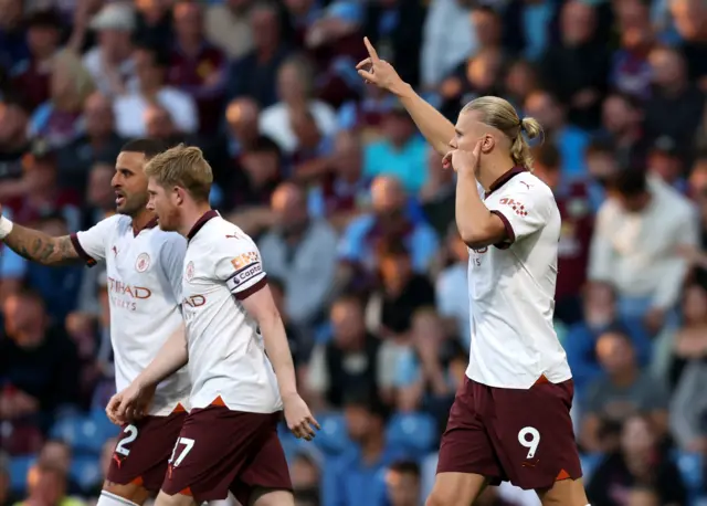 Haaland celebrates after scoring the first goal of the new season.