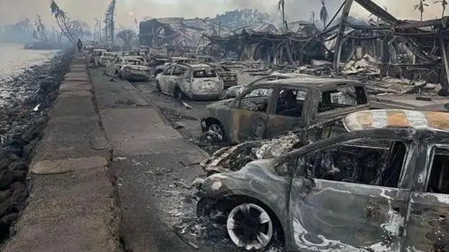 Burned-out cars and buildings in Lahaina