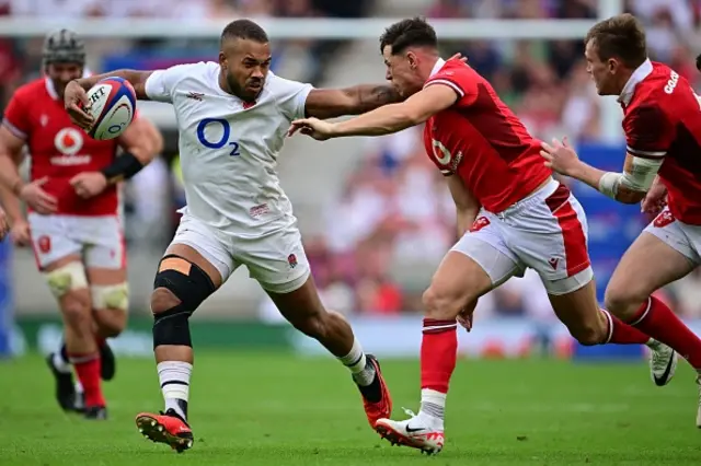 Ollie Lawrence crashing through the Welsh defence