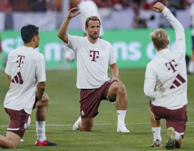 Harry Kane warms up with his Bayern team mates.