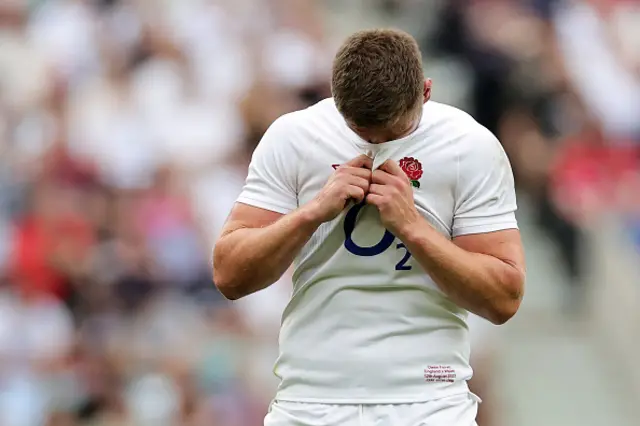 Farrell covers his face with his shirt