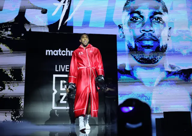 Anthony Joshua in a red robe