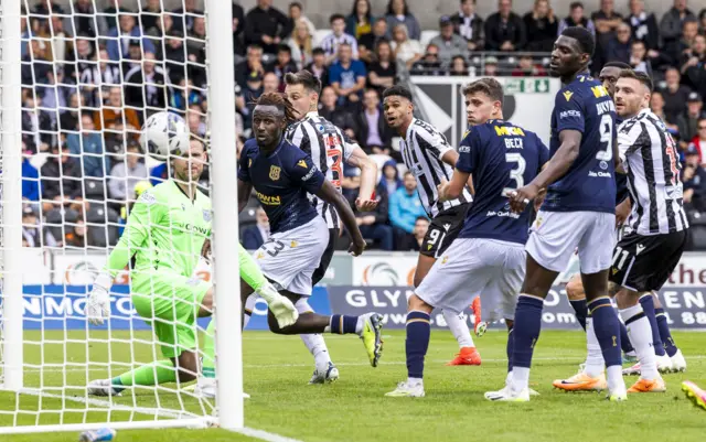 Mikael Mandron watches his glanced header fly in